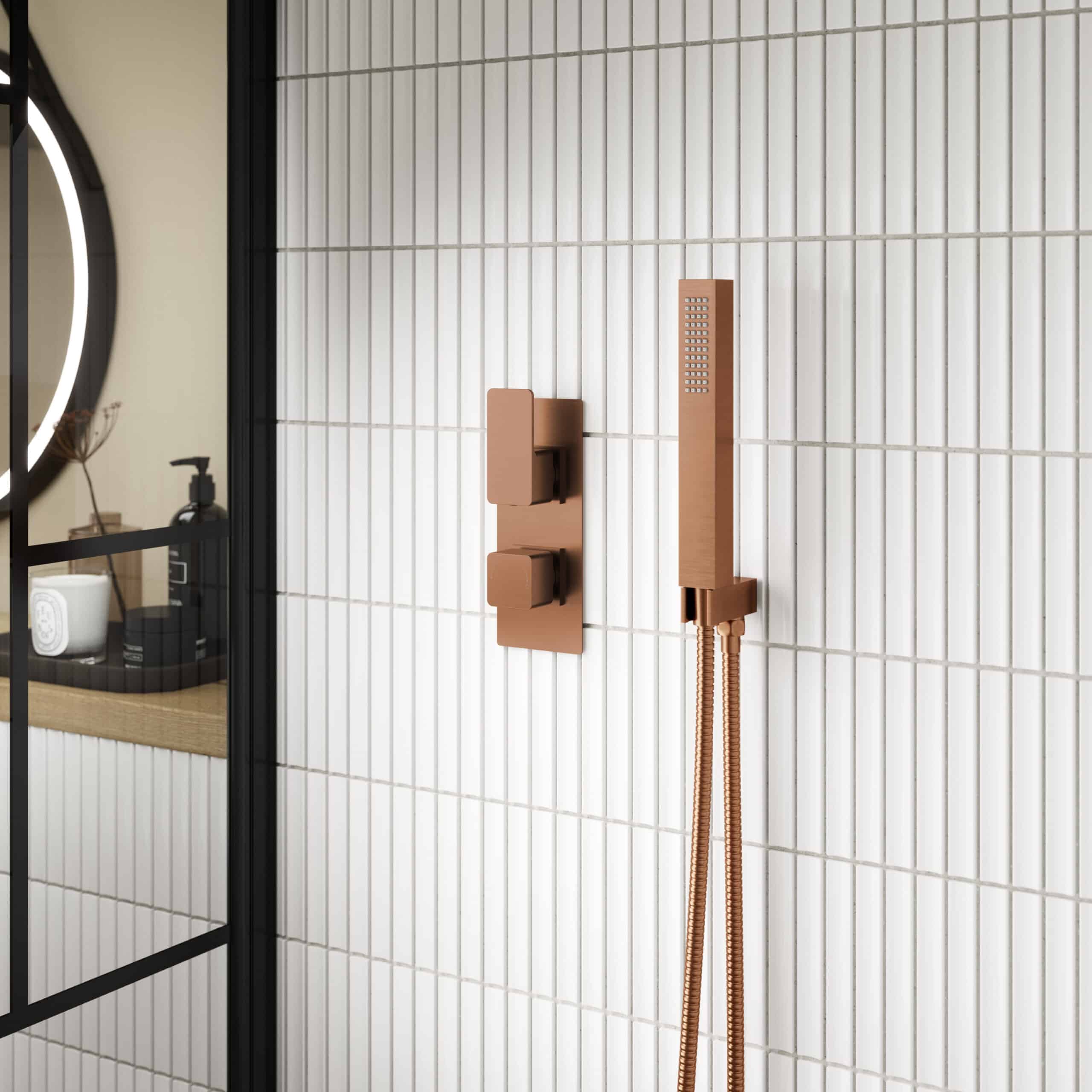 Elegant copper bathroom shower fixture with modern handheld shower and wall-mounted controls, designed for stylish and functional wet room or shower area.