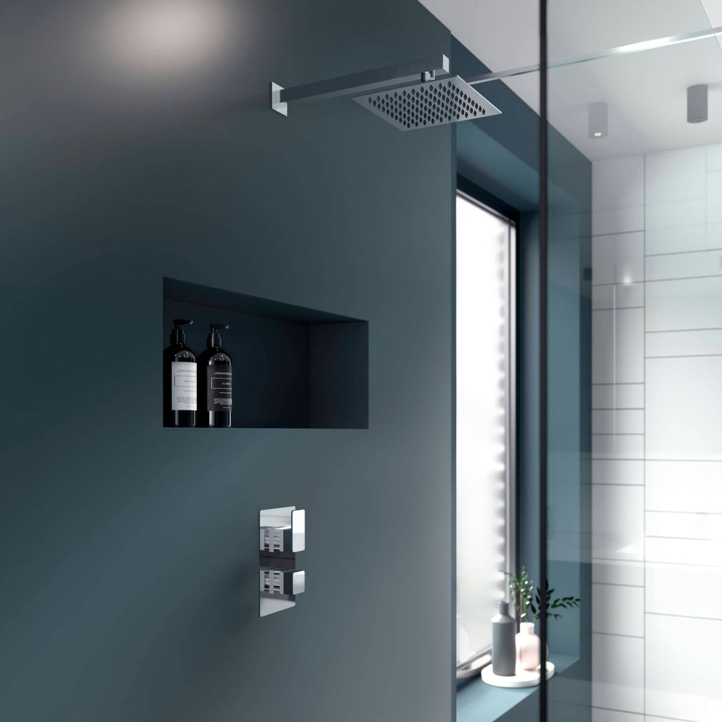 Bubly bathrooms shower head and wall-mounted controls in modern bathroom design, sleek and minimalist, featuring a spacious shower area with built-in shelf and natural light, showcasing contemporary bathroom fixtures and decor.