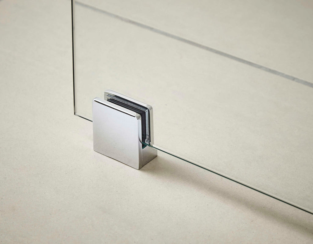 Sleek glass shower door hinge with chrome finish, modern bathroom hardware for stylish shower enclosures.
