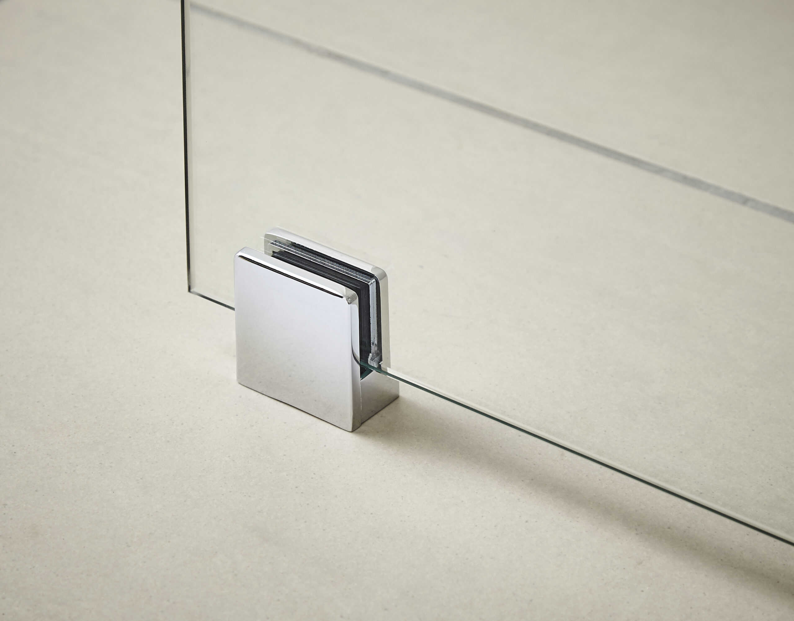 Sleek glass shower door hinge with chrome finish, modern bathroom hardware for stylish shower enclosures.