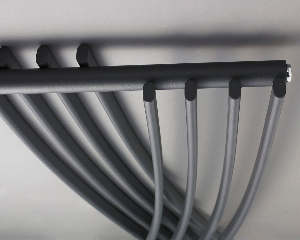 Sleek black towel radiator in a modern bathroom, ideal for heating and towel drying, showcasing stylish and functional bathroom radiators for contemporary bathroom design.